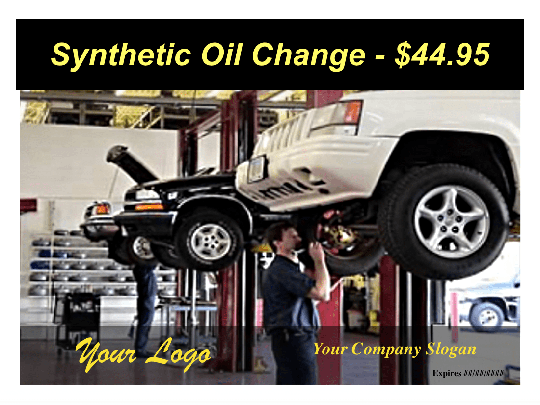 car on rack with mechanic changing the oil